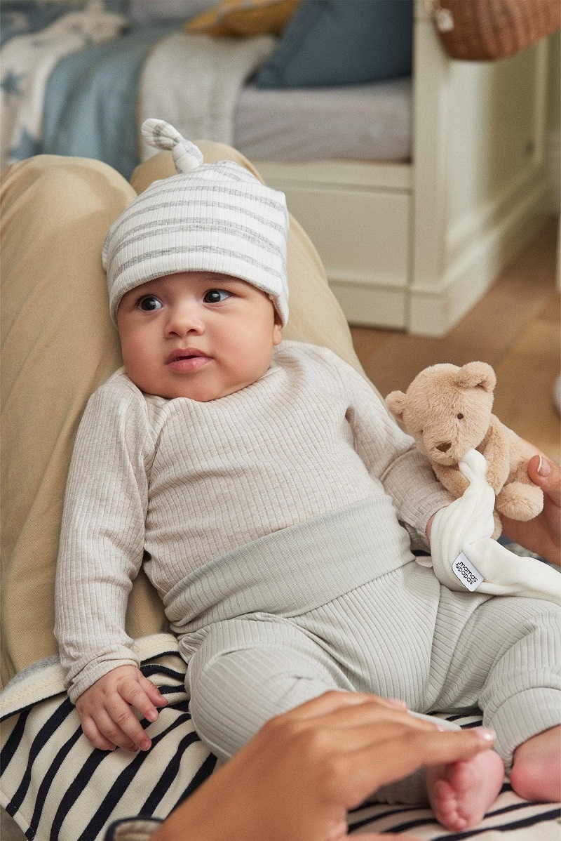 baby wearing organic cotton hat